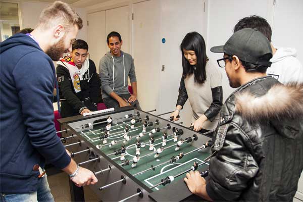 NCG-students-playing-soccer-table