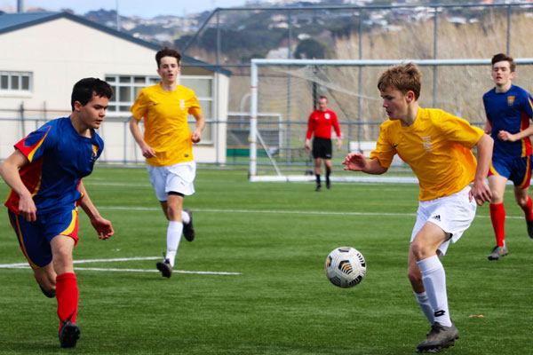 NZ-Kapiti-College-boy-playing-football