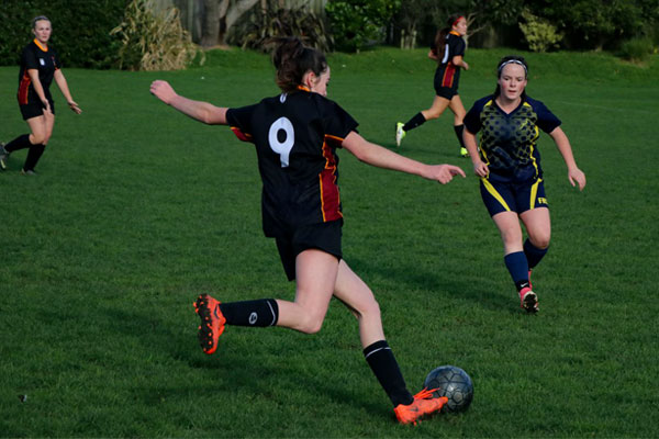 NZ-Kapiti-College-girl -playing-football