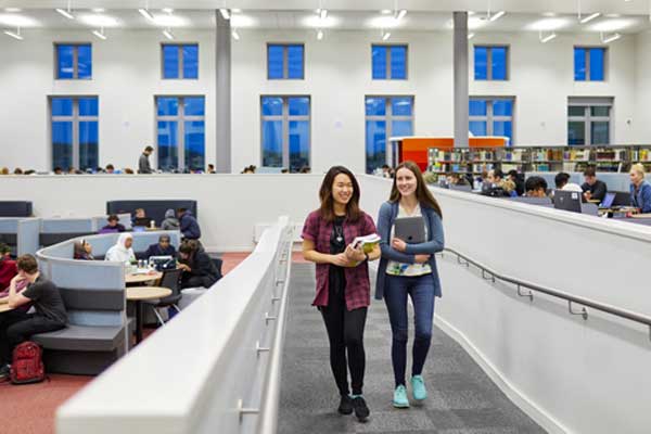 Swansea-University-students-walking-in-the-library